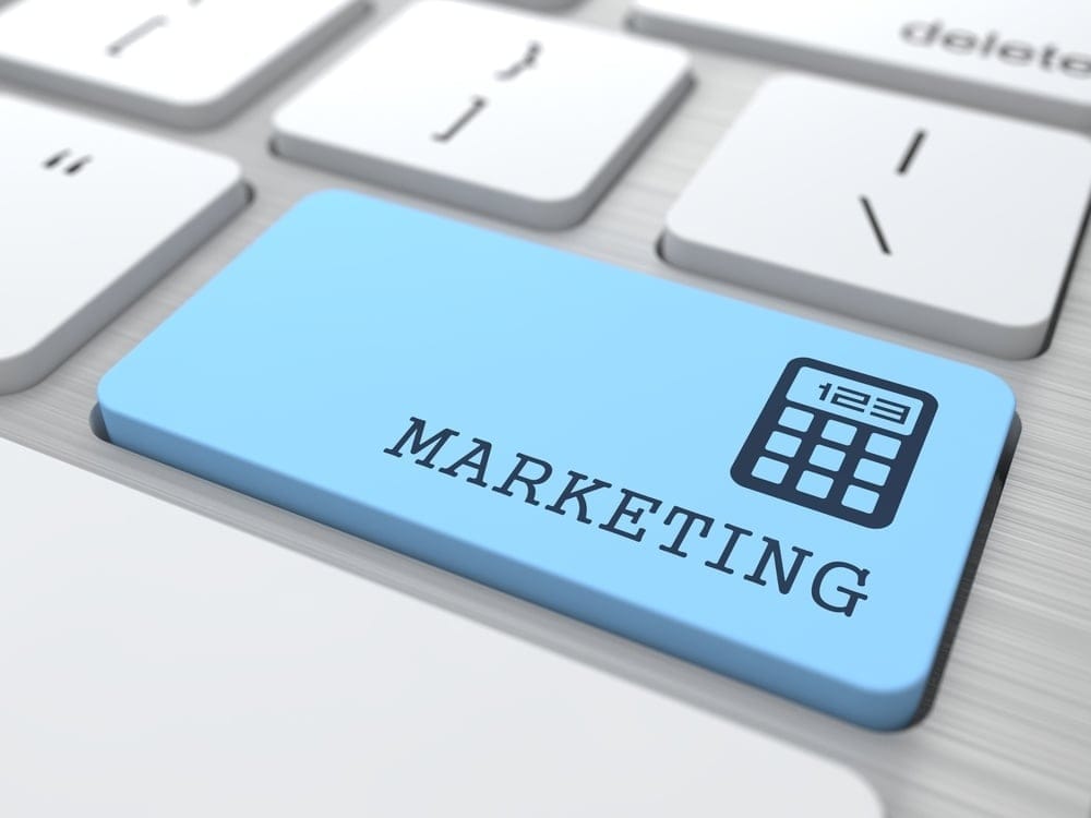 Marketing Concept. Marketing Word on Blue Computer Button